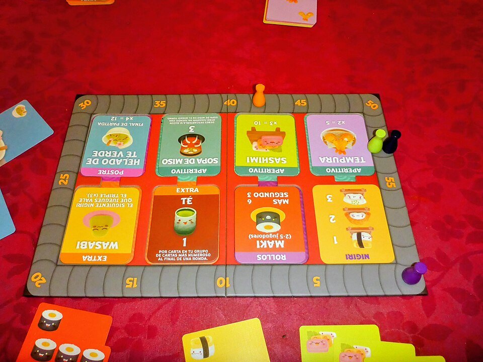 Sushi Go Party! board and colorful menu cards set up for a game