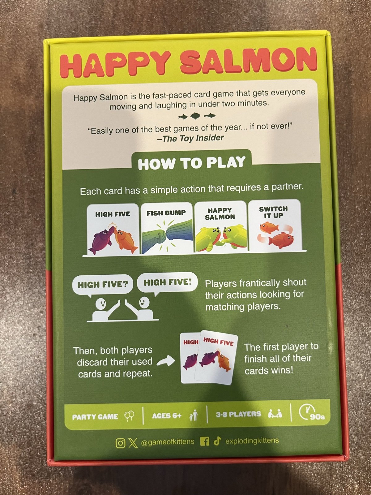 Happy Salmon box back showing the four action cards and how to play