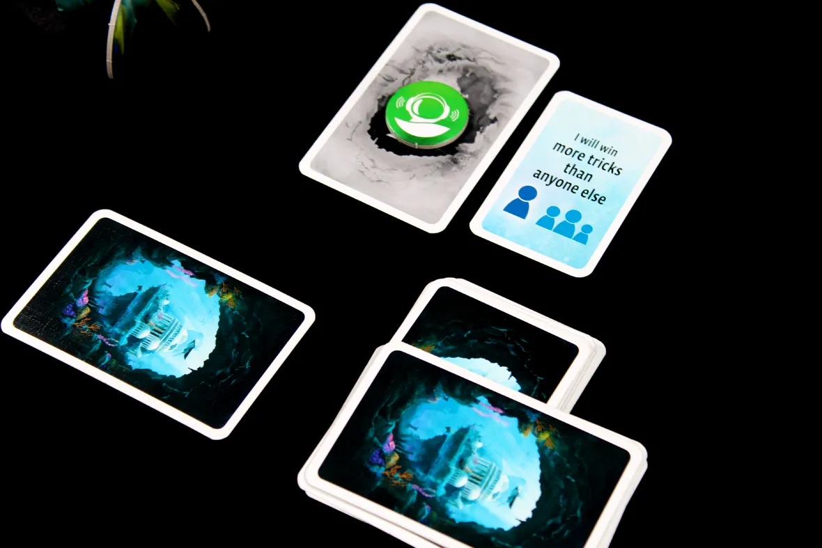 A sonar token beside a task card and face-down cards