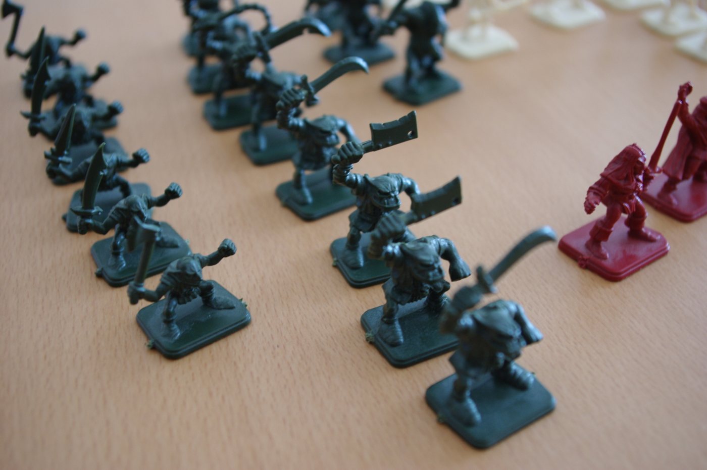 Unpainted HeroQuest miniatures in bare plastic, showing repeated goblin sculpts