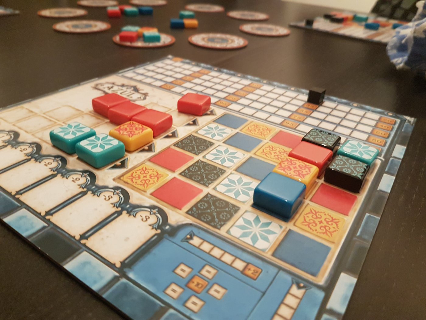 A game of Azul in progress, with factory displays and a player's board