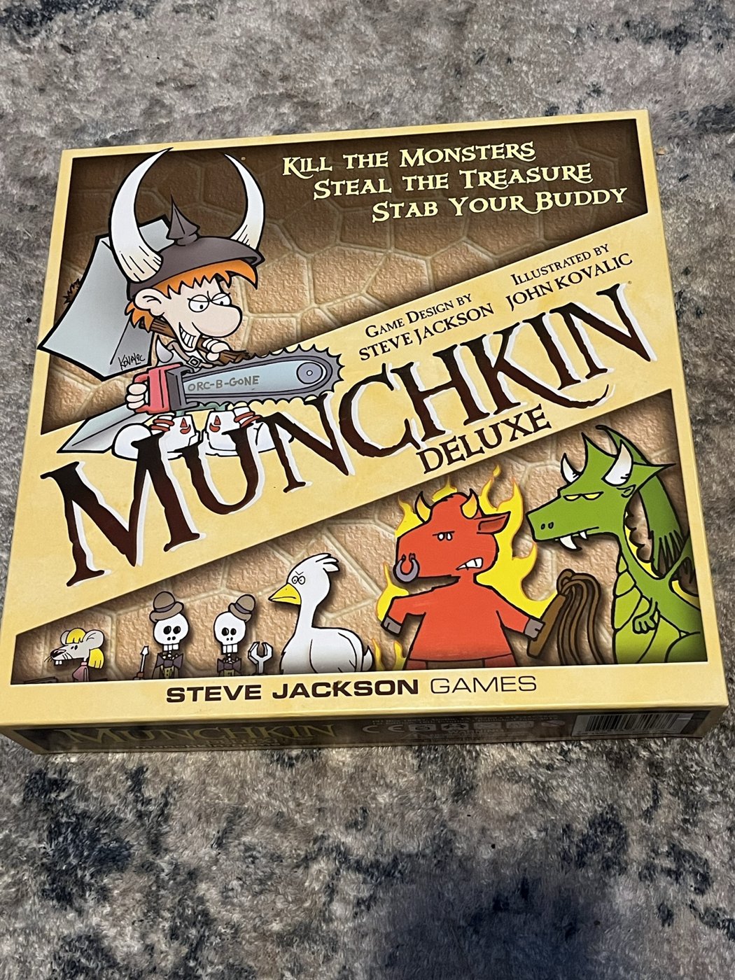 The Munchkin Deluxe box on our table