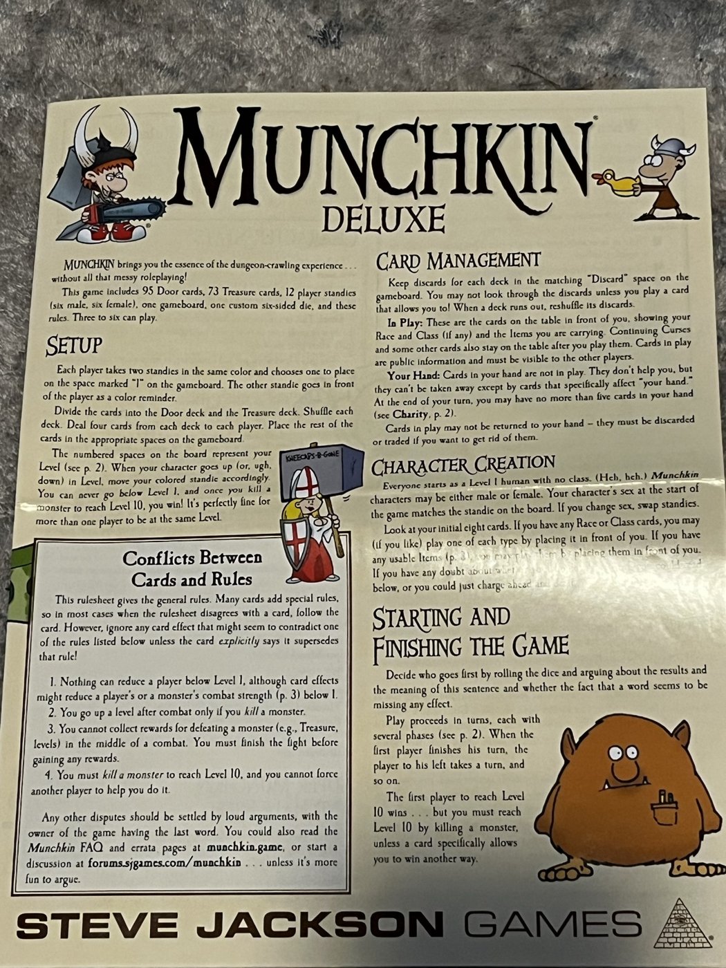 Page one of the Munchkin Deluxe rulesheet showing setup, card management and character creation