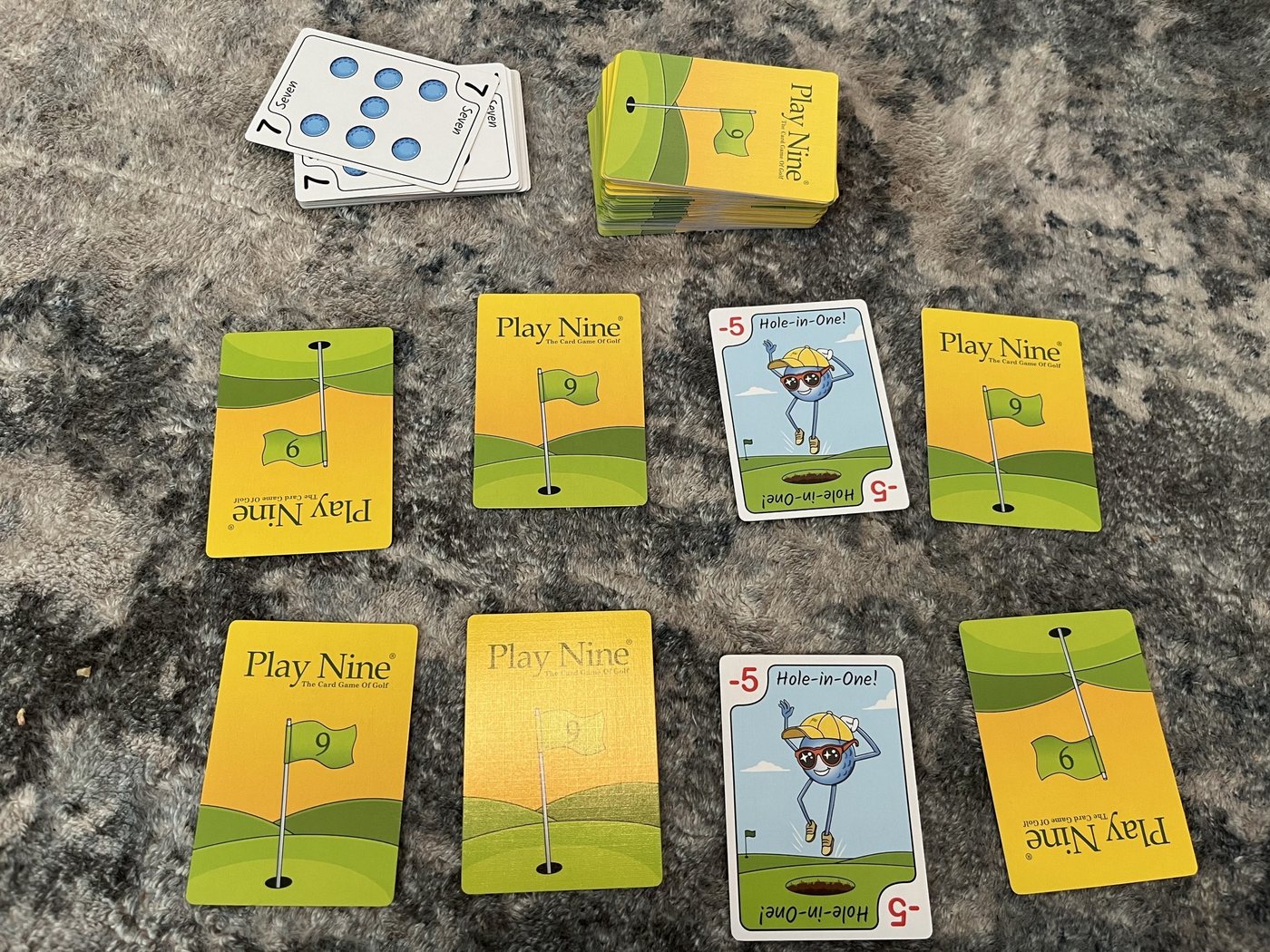 Play Nine layout with two Hole-in-One cards in the same column