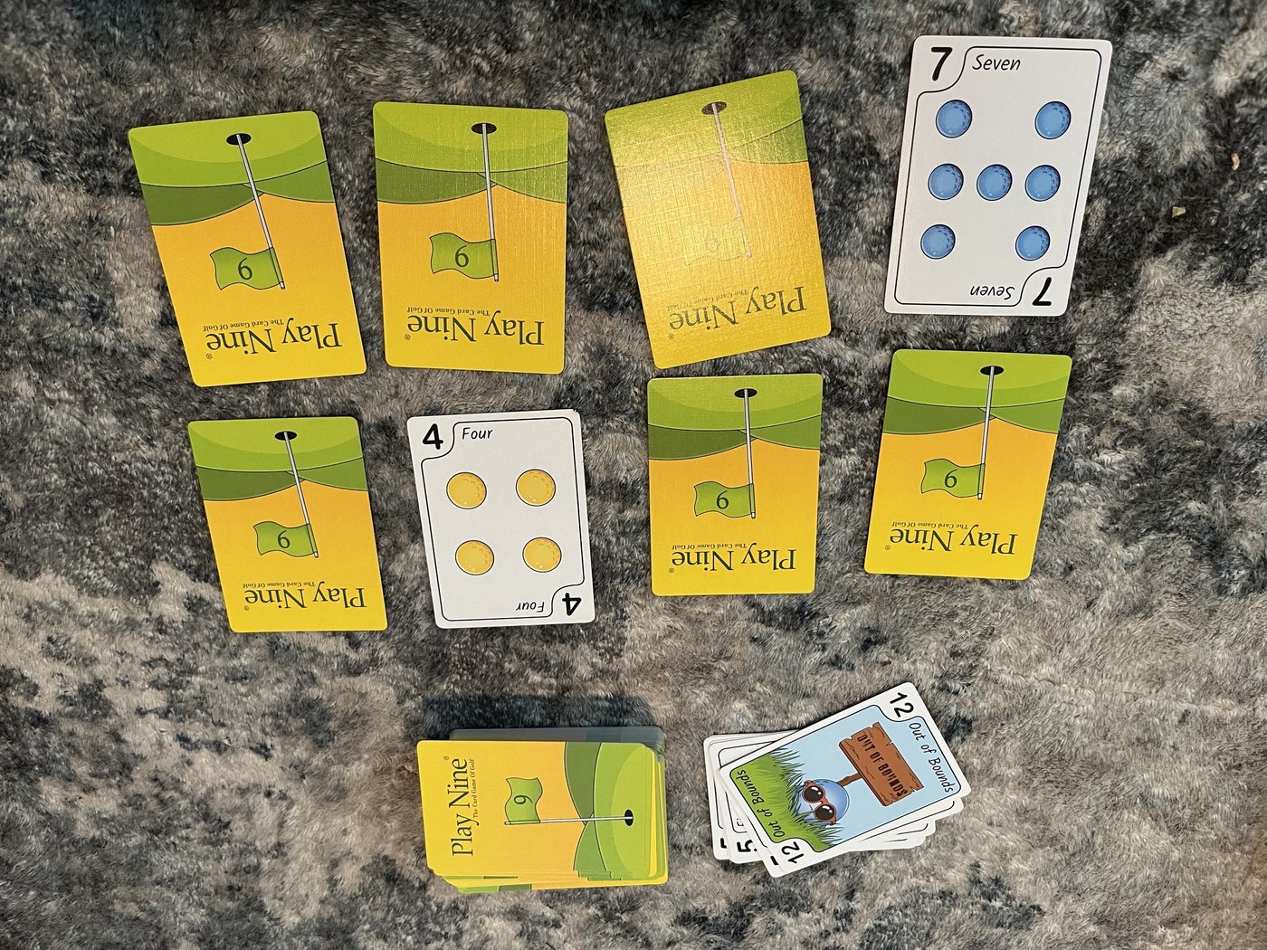 A Play Nine hole in progress with a few cards face up, the draw pile and a 12 on the discard pile