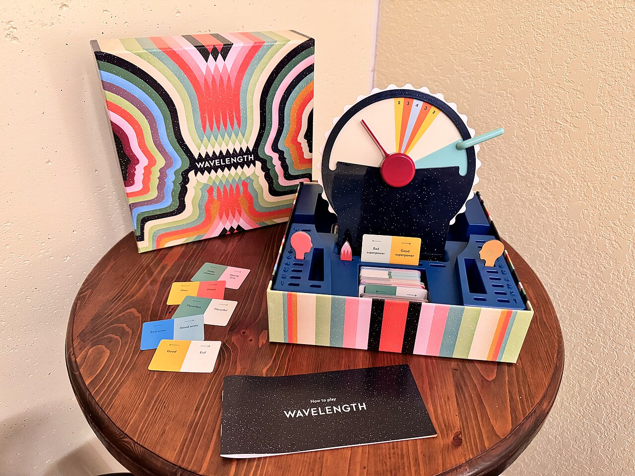 The Wavelength box, dial and spectrum cards on a small table